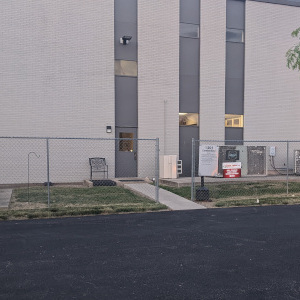 exterior photo of the 1201 Cumberland building indicating which door to come in